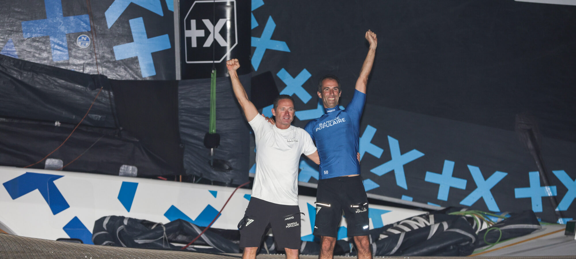 FORT DE FRANCE, MARTINIQUE - NOVEMBER 12 : Ultim category winner Banque Populaire XI, skippers Armel Le Cleac'h and Sebastien Josse, after 14j 10h 14mn 50sec, is pictured during arrivals of the Transat Jacques Vabre in Fort de France, Martinique, on November 12, 2023. (photo by Jean-Marie Liot / Alea)